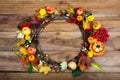 Thanksgiving door wreath with pumpkins and yellow roses Royalty Free Stock Photo