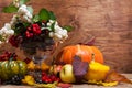 Thanksgiving arrangement with snowberry and rowan in glass vase, copy space Royalty Free Stock Photo