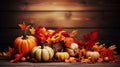 Thanksgiving and fall harvest season. Pumpkins, grape, apple and leaves over dark wood background