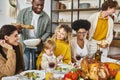 Thanksgiving feast, positive multiethnic friends and