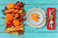 Autumn table setting, menu composition, vintage cutlery, sliced pumpkin. Royalty Free Stock Photo
