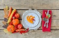 Autumn table setting, menu composition, vintage cutlery, sliced pumpkin. Royalty Free Stock Photo