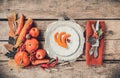 Autumn table setting, menu composition, vintage cutlery, sliced pumpkin. Royalty Free Stock Photo