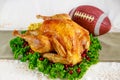 Thanksgiving football game concept. Festive turkey with garnish