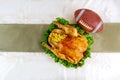 Thanksgiving football game concept. Festive turkey with garnish