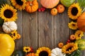 Thanksgiving framework. Flowers, pumpkins and fallen leaves on wooden background. Copy space for text. Halloween Royalty Free Stock Photo