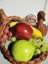 Thanksgiving, Fruit filled cornacopia, wicker turkey basket Royalty Free Stock Photo