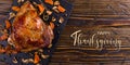 Thanksgiving greetings. Cooked apetite turkey on the table, top view. Kaligraphic capital inscription Royalty Free Stock Photo