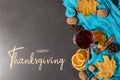 Thanksgiving greetings. Set for mulled wine, wine, spices, leaves, cones, scarf on a gray background, top view. Kaligraphic Royalty Free Stock Photo