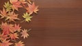 Thanksgiving autumn leaves moving with copy space on wooden background