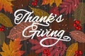 Thanksgiving holiday banner with congratulation text. Autumn tree leaves on wooden background. Autumnal design for fall season Royalty Free Stock Photo