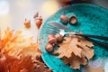 Thanksgiving. Holiday dinner table served, decorated with bright autumn leaves Royalty Free Stock Photo