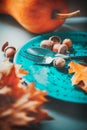 Thanksgiving holiday dinner. Thanksgiving wooden table served, decorated with bright oak leaves and acorns Royalty Free Stock Photo