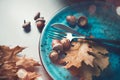 Thanksgiving holiday table served. Wooden table decorated with autumn leaves