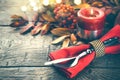 Thanksgiving holiday table served. Wooden table decorated with autumn leaves