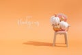 Thanksgiving message with collection of autumn pumpkins on toy chair. Royalty Free Stock Photo