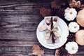 Thanksgiving Place Setting with Decorations over a Rustic Wood background Royalty Free Stock Photo