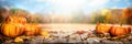 Thanksgiving Pumpkins And Leaves On Rustic Wooden Table With Sunlight Royalty Free Stock Photo