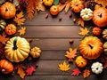 Thanksgiving pumpkins on wooden desk and autumn leaves background Royalty Free Stock Photo