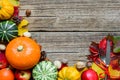 Thanksgiving table place setting with harvested pumpkins, apples, nuts and autumn leaves. thanksgivig Royalty Free Stock Photo