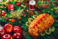 Thanksgiving table served with baked meats, decorated with bright Christmas decor and candles. Christmas dinner with roasted pork Royalty Free Stock Photo