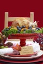 Thanksgiving Table Setting with Roast Turkey on Red White Backgr Royalty Free Stock Photo