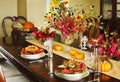 Thanksgiving table setting. Autumn table setting with small pump Royalty Free Stock Photo