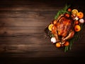 Thanksgiving turkey background with copy space. Roasted turkey garnished with oranges and herbs on rustic wooden table. Festive Royalty Free Stock Photo