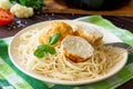 Thanksgiving Turkey dinner. Meat balls turkey with cauliflower in tomato sauce and spaghetti close-up on a wooden table Royalty Free Stock Photo