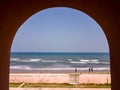 An arch at the ancient Danish fort of Fort Dansborg with a view of the sea in the Royalty Free Stock Photo