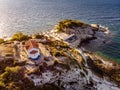 Thasos Island beach bar and church in sunset light, Greece