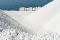 Thassos white marble (dolomite) quarry, Saliara Beach, the Aegean sea coastline, Greece. Global stone industry Royalty Free Stock Photo