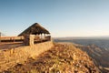 Thatch shelter next to steep - sunset Royalty Free Stock Photo