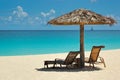 Thatch umbrella and cozy chaise lounge on a beautiful white sand tropical beach Royalty Free Stock Photo