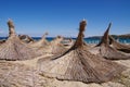 Thatched beach umbrellas