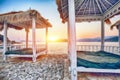 Thatched canopies and awnings on the beach Copacabana at sunset in Dubrovnik Royalty Free Stock Photo