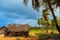 Thatched coconut leaf house or fishing hut on tropical beach Royalty Free Stock Photo