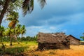 Thatched coconut leaf house or fishing hut on tropical beach Royalty Free Stock Photo