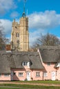 Thatched cottage painted in Suffolk pink