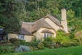 A thatched cottage in woodland in the village of Selworthy