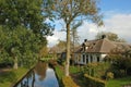 Thatched house on waterside