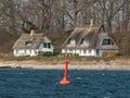 Thatched houses at the beach of the Schlei Royalty Free Stock Photo
