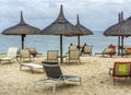 Thatched huts on tropical sandy beach Royalty Free Stock Photo