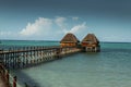 Thatched huts on wooden pier, Zanzibar