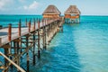 Thatched huts on wooden pier, Zanzibar