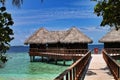 Thatched over-water huts with jetty in the Maldives