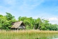 Thatched riverside house, Central America