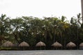 Thatched roof bungalows in colombian beach hotel Royalty Free Stock Photo