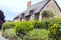 Charming house on a hill with garden full of flowers, shrubs, trees . Royalty Free Stock Photo