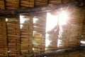 Thatched roof,low angle view..Close up of grunge palm thatch pieces in a row with sunray and flare shining through